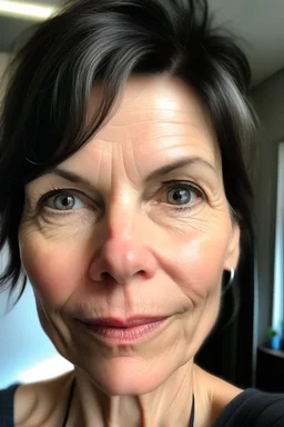 A selfie of a brunette woman, short hair taken at spa salon. showing incredibly beautiful extremely attractive 57-year-old European woman. (She has white skin, tousled black hair, pretty face without makeup, big round brown eyes, cute profiled nose, detailed full lips.)