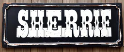large and wide hand painted old western sign that reads: "SHERRIF" white on black with inset boarder stripe in white aged