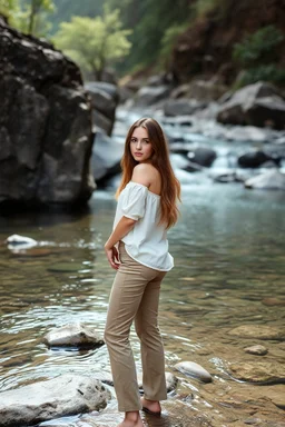 very beautiful lady with pant and blouse looking to camera,upper body close up in beautiful nature with river with clean water and floor with nice rocks