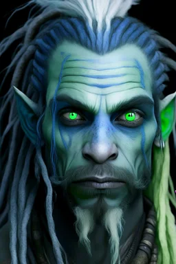 A tieffelin with blue skin and white Dreadlock hair. His pupil-less eyes are green. He wears a small beard.