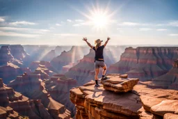 Beautiful view from the Grand Canyon, a person in a victory pose on a single rock outcrop. In the horizon, nice weather and the sun shining,