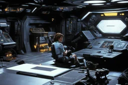 a typical scene in the main room of the Nostromo: Ellen Ripley sits