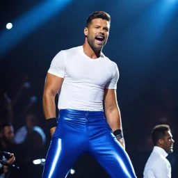 Ricky Martin sings wearing a jogging suit: white crop top and tight blue shiny trousers, on a scene during a concert