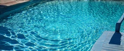 the rippled surface of the water in a pool
