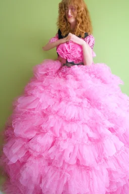 wearing a pink, frilly princess gown