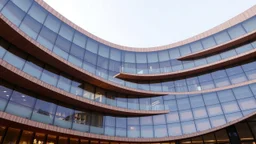 A modern library built with a parametric design, where the building undulates in a sinusoidal wave pattern. The façade is composed of layers of frosted glass and wood, echoing the smooth flow of a mathematical wave. The rhythmic rise and fall of the building’s structure creates a calming, harmonious environment for learning and reflection. Award-winning photograph.