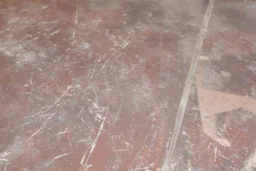 scratched garage floor, from very low perspective