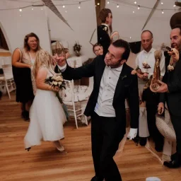 Marc Pellizzari playing drums at his own wedding