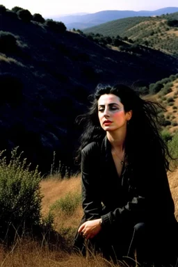 Diamanda Galas playing on a hillside