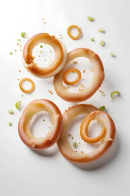 Fresh raw onion rings falling on white background