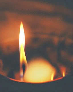 a burning candle in the fire.