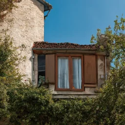 An odd village, details of the houses very accentuated, Max Ernst style, Hasselblad h6d400c, old lady