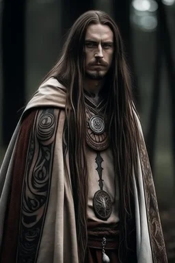 long haired warrior with tribal tattoos and cloak