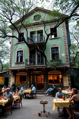 People sitting on tables having diner in front An old abandoned building with all green walls and trees branch around it
