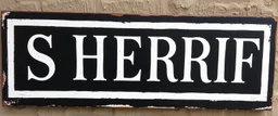 wide hand painted old sign that reads: "SHERRIF" white on black with inset boarder stripe in white