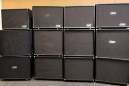 A wall of several concert speakers obe pied up