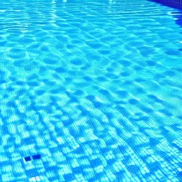 a close up of a pool with blue water, a photo by Carpoforo Tencalla, pinterest, net art, chillwave, creative commons attribution, sabattier filter