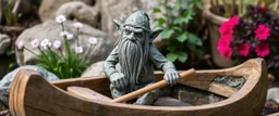 stone garden troll in wooden kayak