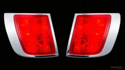 2 vehicle taillight(with chrome trim) on black background, add details and inner glow