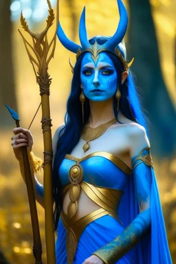 A picture of a beautiful blue faced indian goddess with skin painted blue, blue painted body, blue painted torso, wild black hair, stag antlers, elven ears, golden skirt, holding a staff in a sunny forrest