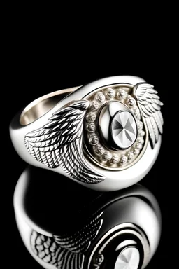 A white stone ring with an angel on it with wings .