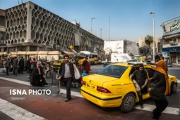 a street in Tehran with a taxi