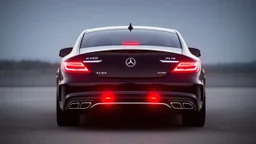 Full image of the rear view of a black Mercedes-Benz CLS with lights on