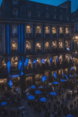 A full street in a big city with frech style building. The street is filled with blue flags held by people late at night