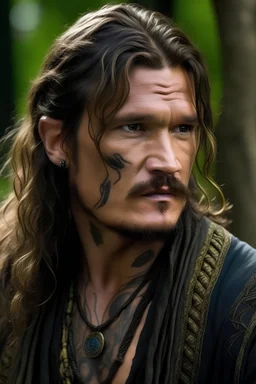 pedro pascal as long haired celtic warrior with tribal tattoos