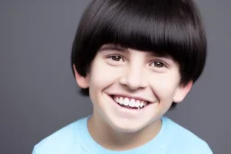 Photo of a boy with a Huge grin and Bowl cut black hair