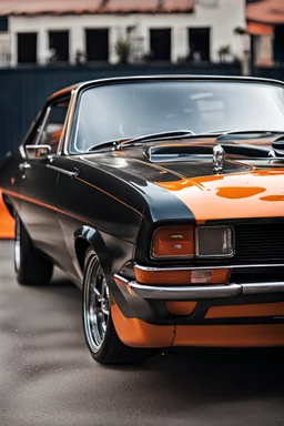 a close up of a black ford capri with a orange paint