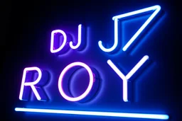 A simple neon sign labeled "DJ ROY" black background