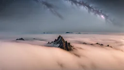 looking up at misty foreground and night sky background, no sun, single sharp narrow mountain peak coming through the mist in the center