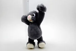 Scruffy fluffy grey puppet plush Bunny, holding with both hands onto a post while being blown by the wind, extending vertically, panicked. on white background