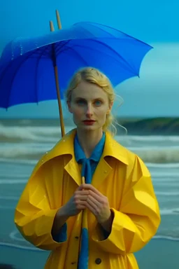 In the music video, a 23-year-old woman with blonde hair and bright blue eyes stands in the sea, dressed in a yellow fisherman's jacket. She holds an umbrella, but it offers no protection from the pouring rain. Around her, seahorses are moving. The rain is pouring heavily. She is standing in the middle of the sea. You can see here completely. The rain is pouring really really hard. horses