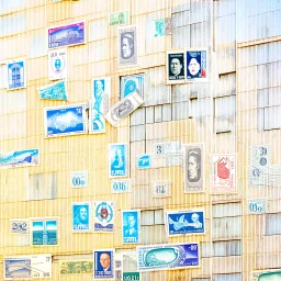 A building is covered with postage stamps