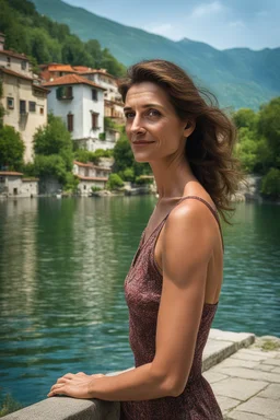 Create a realistic photograph of a small Italian town at Como Lake in late spring with a portrait of a 40-year-old, beauty, slim Polish woman with brown hair. Use a 30 mm lens and a Fuji T30 camera, mild light, warm.