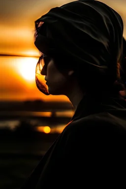Seorang wanita berkacamata jilbab hitam terlihat dari belakang sedang menatap matahari terbenam