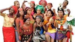 Nigerians from different ethnic and tribal groups posing for a picture dressed in the ethnic attire