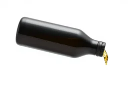 whole bottle(black plastic, 1 liter, quart, motor oil) floating on an angle in middle of image while pouring(oil) out down from the bottle's opening. white background, Smooth vector