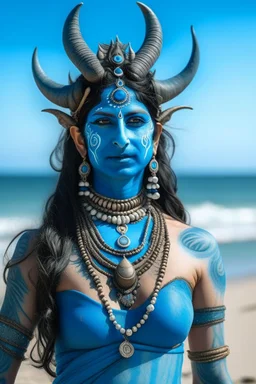 A photo of a blue skin Hindu goddess with painted blue face and body skin, wavy black hair deer antler horns, standing on a sunny beach