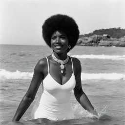 1970s Afroamerican woman playing in the sea of port rico, looking at the camera, close to the beach,