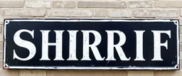 large and wide hand painted old sign that reads: "SHERRIF" white on black with inset boarder stripe in white