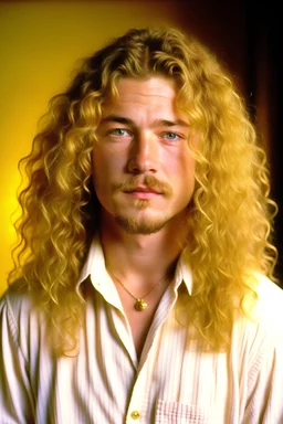a man with long wavy blonde hair, past shoulder length, brown eyes, a handsome face, wearing a loose white linen shirt. He looks al little bit like the young Robert Plant.
