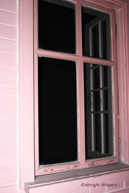 Midnight Whispers ghost window with a scary shadow behind