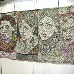 A Wide Panel in which 5-6 potraits are deveped with Wool threads tapestry artwork connected with each other through threads,