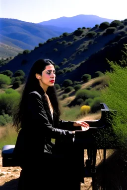 Diamanda Galas playing piano on a hillside