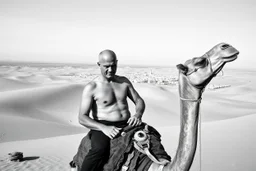 man looking like "Walter White" in breaking bad tv show, bald, with bare chest riding on a camel in sahara in desert, panorama, black and white photo, staring at a small town in horizon