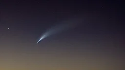 Comet in the night sky over the plain