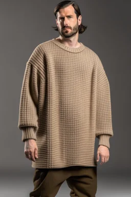 Man's large and long and beige knitted jumper in square shape and bell shape sleeves